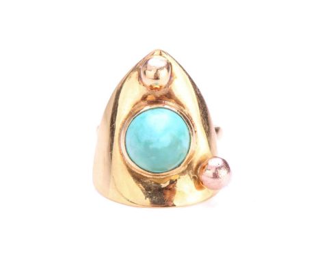 A turquoise dress ring, comprises a high-domed turquoise cabochon collet set on a curved triangular panel, further decorated 