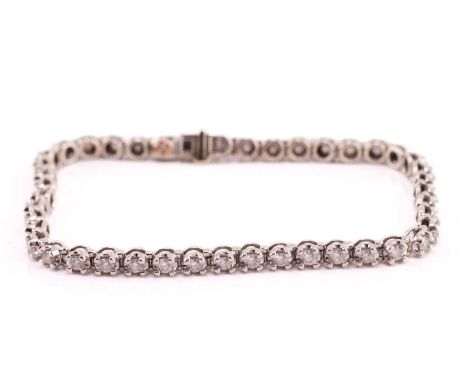 A diamond line bracelet in 9ct white gold, comprising a single row of brilliant-cut diamonds, approximately measures 2.0 mm i