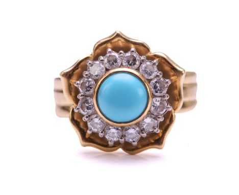 A turquoise and diamond cluster ring in floral design, centred with a round turquoise cabochon of 7.1 mm, encircled by a bril