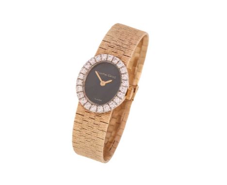 A 9ct yellow gold Bueche-Girod diamond set lady's watch, featuring a hand-wound Swiss-made movement in a 9ct yellow gold case
