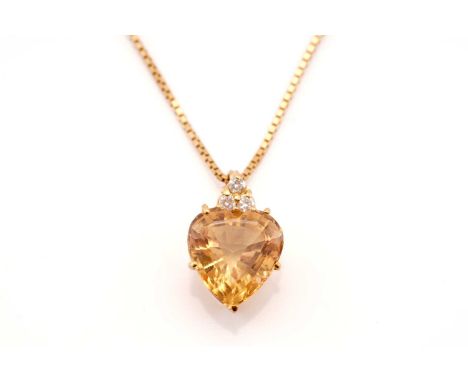 A topaz and diamond pendant on chain, comprises a heart-shaped yellow topaz of 11.3 x 10.6, in a yellow metal claw setting fu