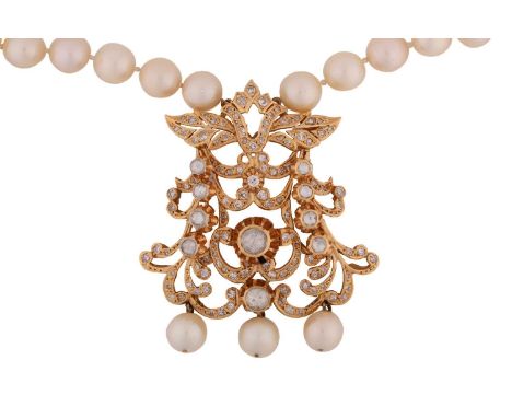A pearl necklace with a diamond-set pendant, the axe-shaped pendant comprises intricated foliate and scrolled openwork, scint