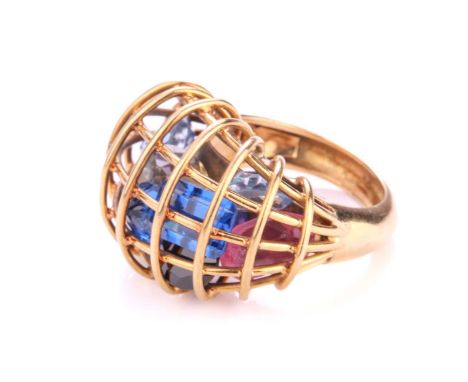 A 'caged' cocktail ring filled with polychromatic paste, with a wired domed cage encasing loose faceted paste, to a D-section