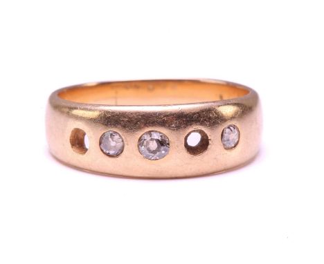 An 18ct gold ring set with diamonds, comprising a plain band and later-added gemstones, graduated single-cut diamonds flush s