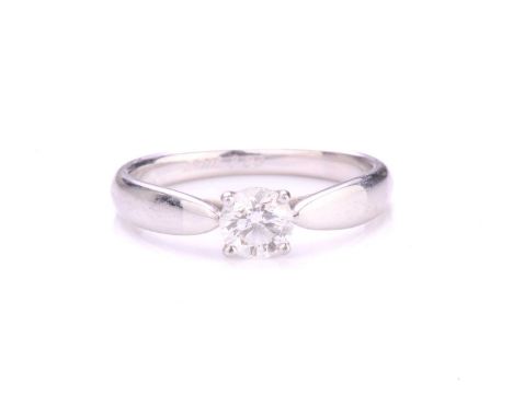 Tiffany &amp; Co. - A diamond solitaire ring, featuring a round brilliant-cut diamond of 0.33ct, claw set to tapered shoulder