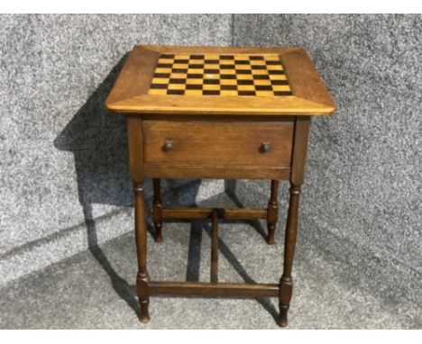 Early to mid 20th century oak games table with inset tile top and two rotating drawers below