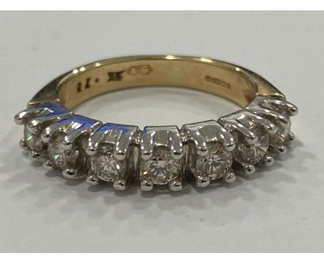 Ladies 9ct yellow gold 7 stone diamond band. Comprising of 7 round brilliant cut diamonds set in white gold claw setting apx 