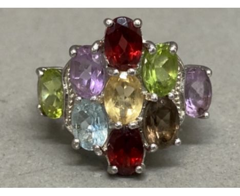 A silver and multi coloured stone ring size R 1/2 7.8g gross