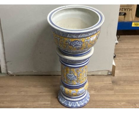 A ceramic jardiniere on stand