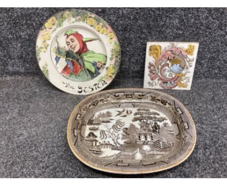 An ironstone meat plate by E F Bodley &amp; Sons, Royal Doulton The Jester plate and an antique tile