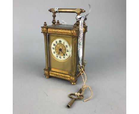 CARRIAGE CLOCK, the enamel dial with Arabic numerals in black, 15cm high including handle