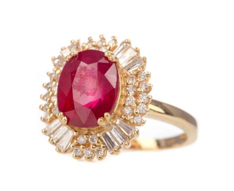 GLASS FILLED RUBY AND DIAMOND RING,set with an oval ruby, flanked by tapered baguette and round brilliant cut diamonds, marke