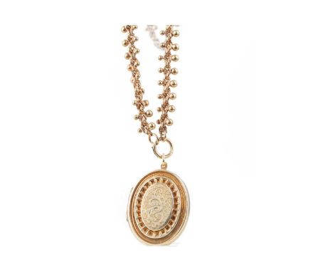 GILT LOCKET ON CHAIN,with engraved decoration to the front panel, on an ornate ropetwist chain with spherical decoration