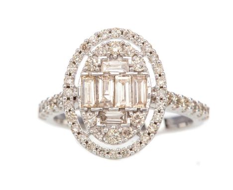 DIAMOND DRESS RING,formed by round and baguette cut diamonds totalling approximately 1.06 carats, in nine carat white gold, s