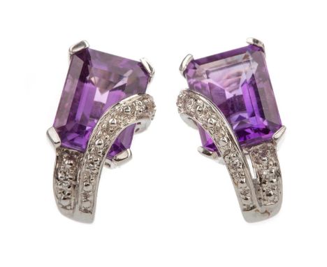 PAIR OF WHITE GOLD AMETHYST AND DIAMOND EARRINGS,the step cut amethysts with overlaid illusion set diamond section, in nine c