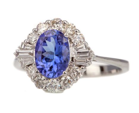 TANZANITE AND DIAMOND RING,set with a tanzanite of approximately 1.34 carats, within a diamond halo totalling approximately 0