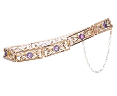 AMETHYST BRACELET,the openwork panels each set with a round amethyst, marked 9CT, 14.2gGenerally worn.&nbsp;Some chips &amp; 