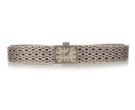 OMEGA EIGHTEEN CARAT GOLD MANUAL WIND WRIST WATCH the rectangular dial with baton hour markers, 11mm case, on an eighteen car