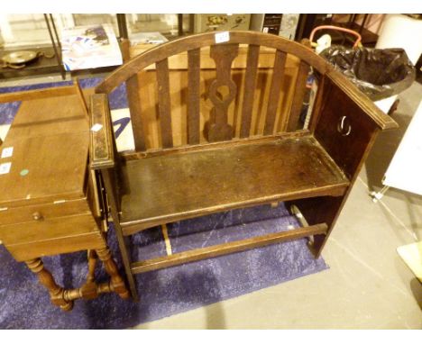 Dark oak Arts and Crafts two seat bench with pierced sides and bar back L: 80 cm D: 33 cm 