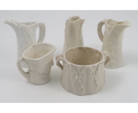 Three Royal Worcester blank leaf moulded jugs, heights 3.5ins, together with a Royal Worcester blank leaf moulded bowl, heigh
