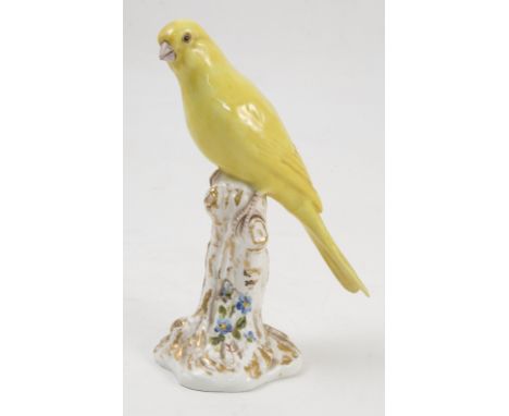 A Royal Worcester model, Canary, on a gilt and white stump decorated with flowers, model number 2665 Condition report: good c