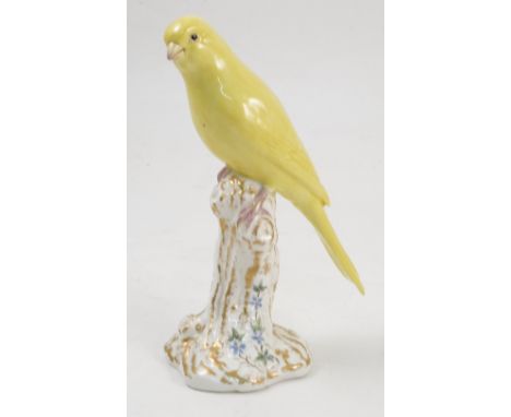 A Royal Worcester model, Canary, on a gilt and white stump decorated with flowers, model number 2665 Condition report: good c