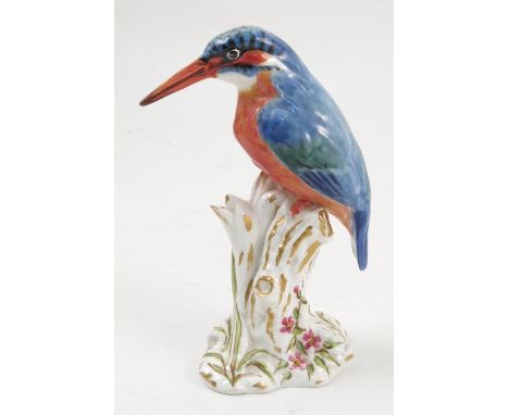 A Royal Worcester model, Kingfisher, on a gilt and white stump decorated with flowers, model number 2666, with puce mark, dat