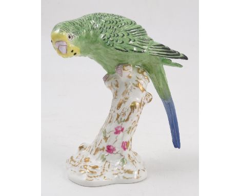 A Royal Worcester model, male Paroquet, in green, on a gilt and white stump decorated with flowers, model number 2664 Conditi