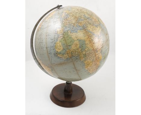 A Philip's Challenge globe, scale 1:37,500,000, diameter 13.5ins, circa 1960, on a wooden base, height 18.5ins