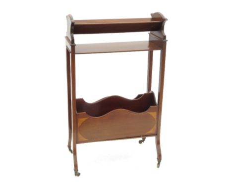 An Edwardian mahogany book stand, having book trough with shelf to the upper section, over a two division Canterbury base, wi