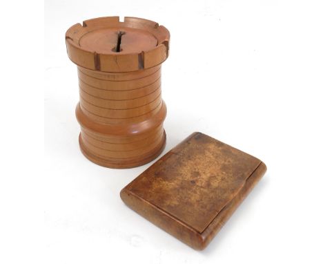 A turret shaped treen money box, possibly apple wood, height 3.5ins, together with a burr wood snuff box