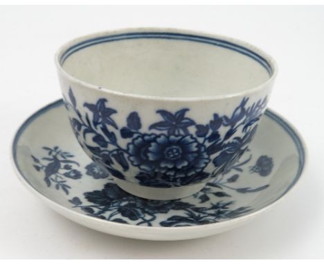 A Worcester first period tea bowl and sauce, decorated in the blue and white three flowers pattern Condition report: some min