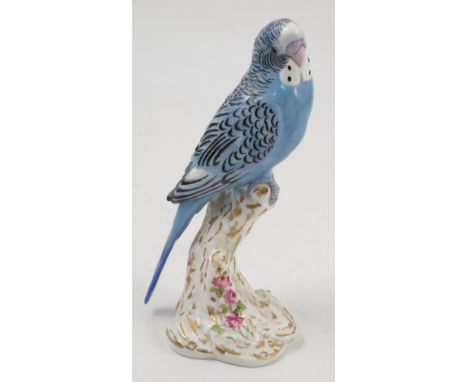 A Royal Worcester model, female Paroquet, on a gilt and white stump decorated with flowers, model number 2663 Condition repor
