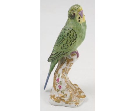 A Royal Worcester model, female Paroquet, on a gilt and white stump decorated with flowers, model number 2663 Condition repor