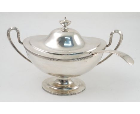 A silver two handled covered tureen, of oval form, with urn finial, ribbed handles and rim, raised on an oval pedestal steppe