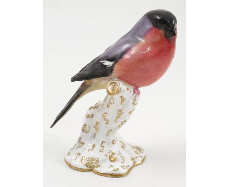 A Royal Worcester model, Bullfinch, on a gilt and white stump, model number 2662, dated 1919 Condition report: good condition
