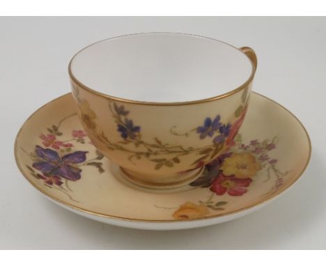 A Royal Worcester blush ivory tea cup and saucer, decorated with floral sprays, dated 1908 Condition report: good condition