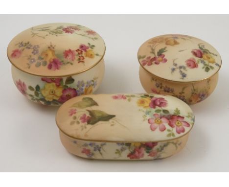 A Royal Worcester patch box and cover, decorated with flowers, dated 1904, diameter 3ins, together with another smaller examp