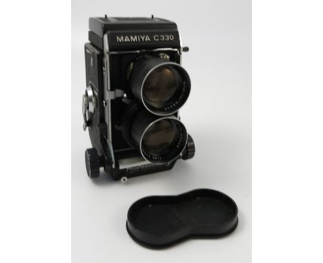 A Rolleiflex Compur Rapid camera, with twin lens, cased, together with a Mamiya C330 twin lens, and a plate camera with lable