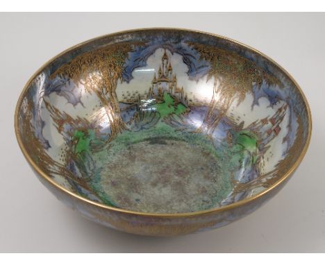 A Royal Worcester crown ware bowl, decorated with castles and trees in lustre, dated 1925, shape number CW163, diameter 10ins
