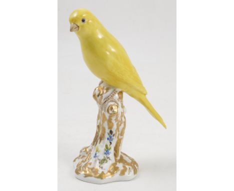 A Royal Worcester model, Canary, on a gilt and white stump decorated with flowers, model number 2665 Condition report: good c
