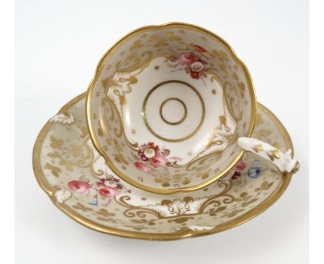 A set of six 19th century Davenport tea cups and saucers, decorated with flowers to a border of grey and gilt, printed puce m