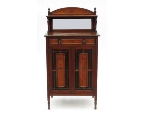An Aesthetic movement cabinet, with mirror back and shelf under, fitted with a frieze drawer and two panelled doors below, th