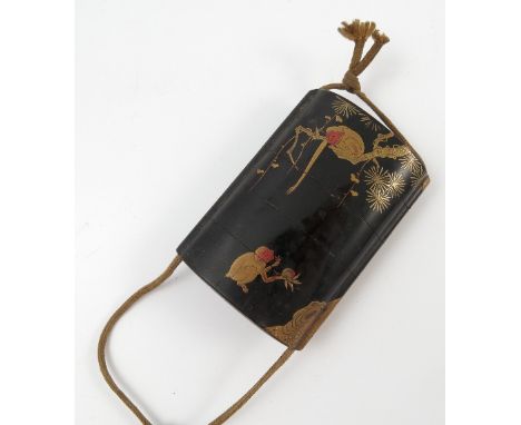 A Japanese five section inro, decorated in black lacquer and gilt with a tree, foliage and monkeys, height 3ins, together wit