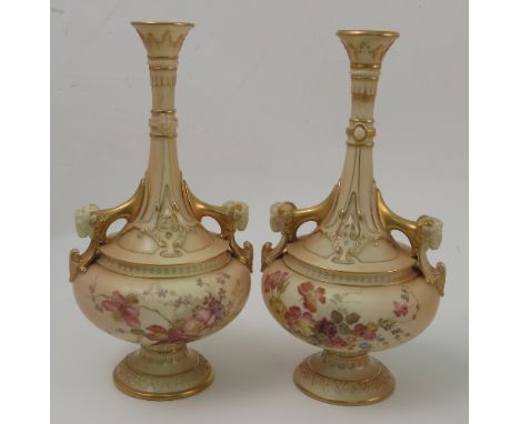 A pair of Royal Worcester blush ivory vases, decorated with floral sprays to rams mask handles, af, dated 1894, shape 1600, h