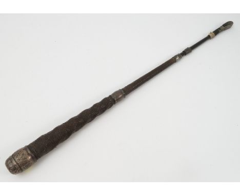 A hunting crop, with white metal mounts, originally belonging to the Squire of Dukinfield 