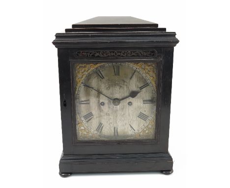 A Georgian ebonised bracket clock, with striking fusee movement, the back plate engraved with flowers and scrolls as well as 