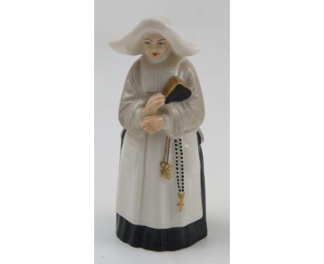 A Royal Worcester candle snuffer, modelled as The Nun, dated 1925, height 3.75ins Condition report: minor nibbles to base of 
