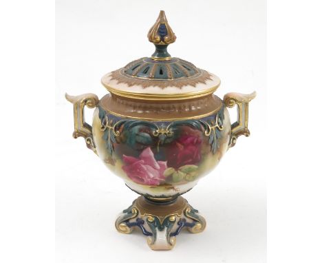 A Royal Worcester covered vase, decorated with roses, having a pierced cover, twin handles and raised on a pedestal base, sha