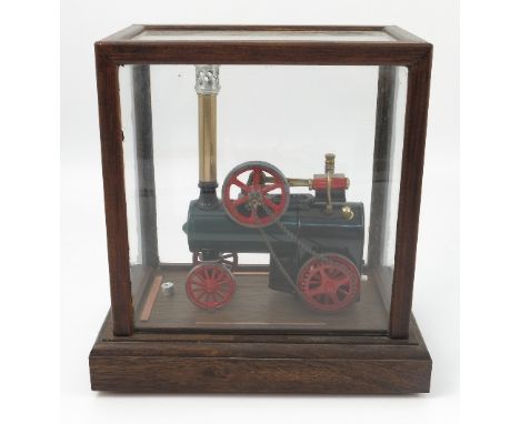 A Marklin toy portable steam engine, the cylinder with mounted steam cylinder, spoke flywheel with chain linkage to rear driv